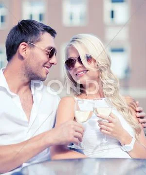 Couple drinking wine in cafe Stock Photos