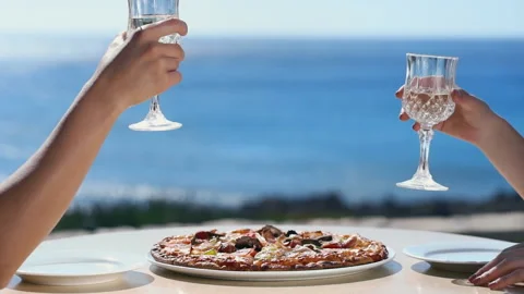 Couple drinking wine in cafe in the seaside. Best friends spend summer time Stock Footage 181174598