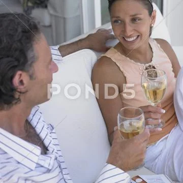 Couple Drinking Wine On Couch
