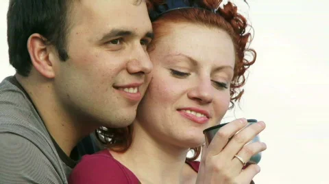 Couple drinks from one mug Stock Footage 805851