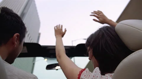 Couple driving in convertible Stock Footage 46222887