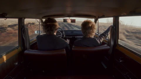 Couple Driving down Empty Rural Road and Having Conversation Stock Footage 306725499