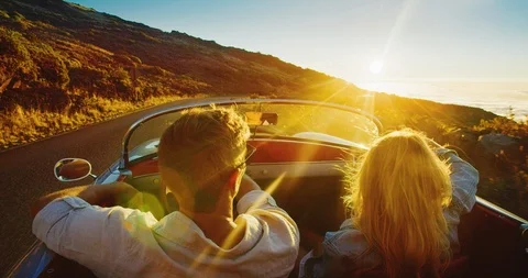 Couple Driving into the Sunset Stock Footage 86568366