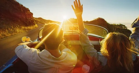 Couple Driving into the Sunset Stock Footage 86568793