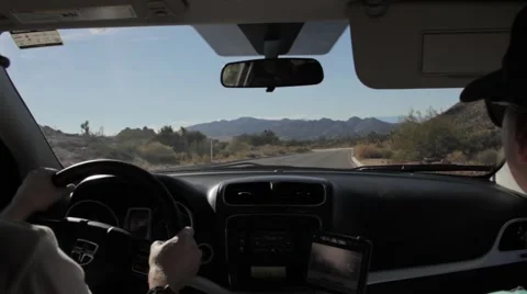 Couple driving through the desert Stock Footage 56340769