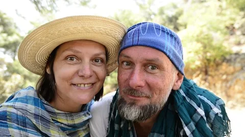 Couple during travel looking at camera smiling and laughing Video stock 63315294