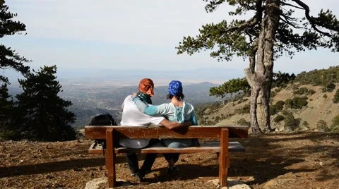 Couple during a trip, rest, sitting on a bench Video stock 63341395