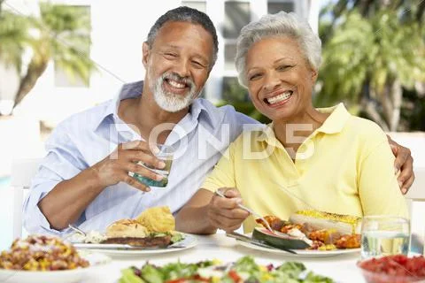 Couple Eating An Al Fresco Meal Stock Photos