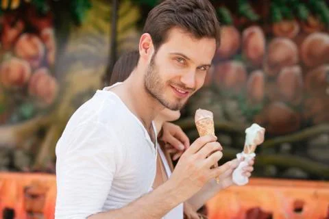 Couple eating ice creams, Paris, Ile-de-France, France Stock Photos