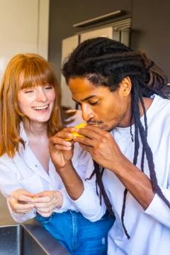 Couple eating mango Stock Photos
