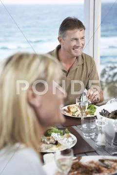 Couple Eating Meal Near The Sea Stock Photos