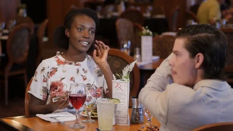 Couple eats salad hand made from soup and salad bar smiling and taking to eac Stock Footage 89365291