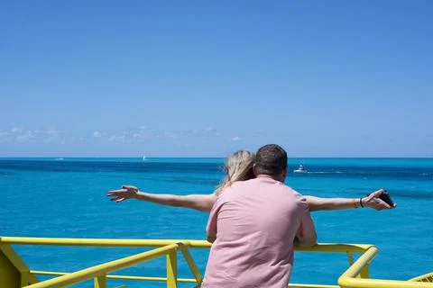 A couple embraced on the deck of a ship Stock Photos