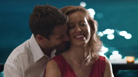 Couple embracing on balcony in moonlight. Video stock 43681247
