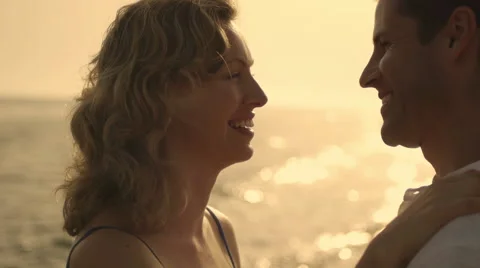 Couple embracing on beach at dusk. Stock Footage 43655929
