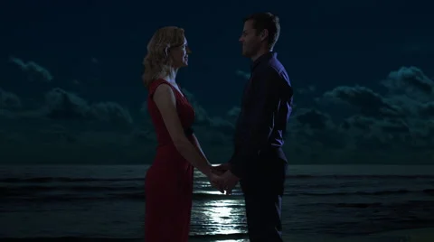 Couple embracing on the beach at dusk. Stock Footage 43680977