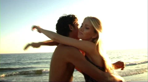 Couple embracing on beach Stock Footage 43689090