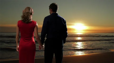 Couple embracing on the beach at sunset. Stock Footage 43680970