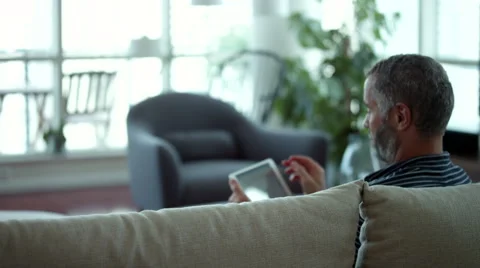 Couple embracing on couch. Stock Footage 64120681