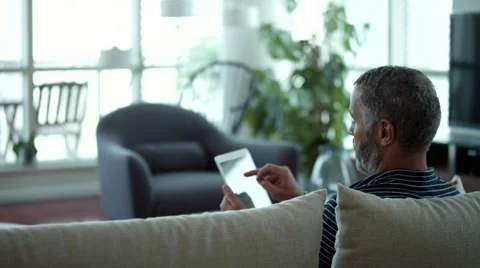Couple embracing on couch. Stock Footage 64120845