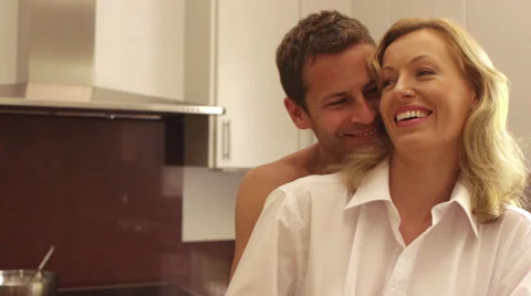 Couple embracing in kitchen. Stock Footage 43658687