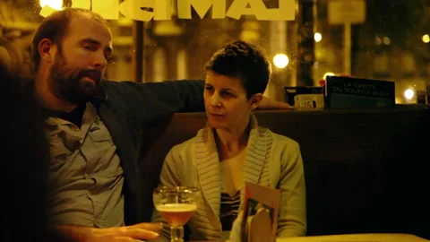 Couple Embracing at Pub Seating Booth Tilt Down Shot 스톡 동영상 346822405