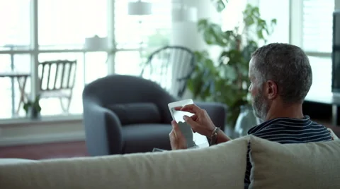 Couple embracing on sofa. Stock Footage 64121261