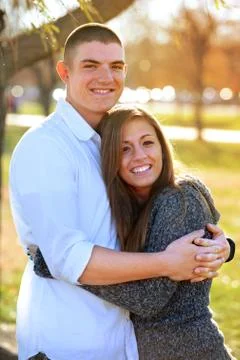 Couple Embracing at Sunset Stock Photos