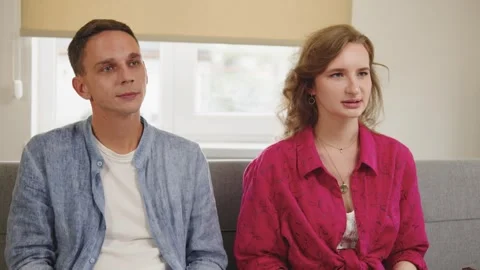 Couple Engaged in Discussion within a Comfortable Home Environment. girl talks Vídeo Stock 292795370