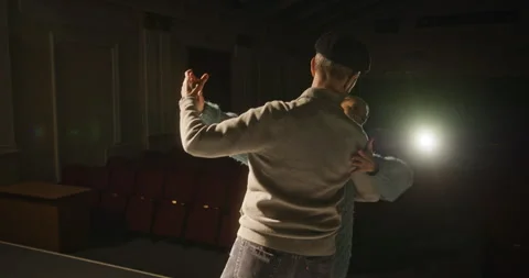 A Couple Engaged in an Elegant Dance Performance on Stage Enhanced by Soft Stock-Footage 305100477