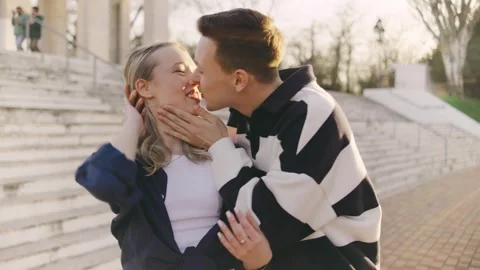 Couple engages in a fun activity, with one partner covering the others eyes Stock Footage 314404941