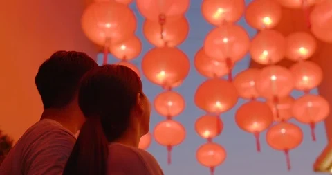 Couple enjoy look at the red lantern for Chinese new year Stock Footage 102248017