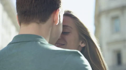 Couple enjoy a quick kiss while in the city Stock Footage 63032024