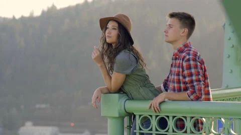 Couple Enjoy The View From St Johns Bridge, Woman Points To Something Stock Footage 60994033