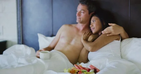Couple Enjoying Breakfast in Bed Stock Footage 84750589