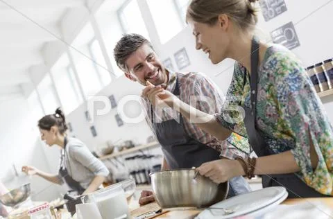 Couple enjoying cooking class kitchen Stock Photos