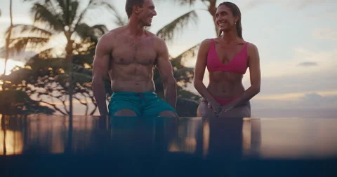 Couple Enjoying Drinks in the Pool on Vacation Stock Footage 226046284