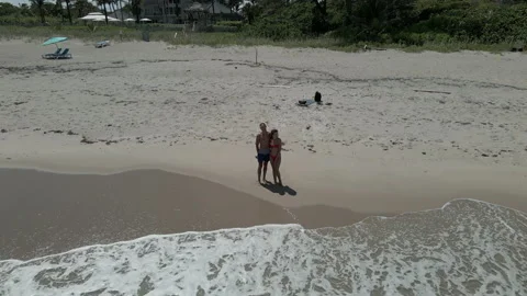 Couple enjoying on the ocean beach Stock Footage 154144675