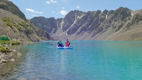 Couple enjoying paddleboarding. Stock Footage 280480144