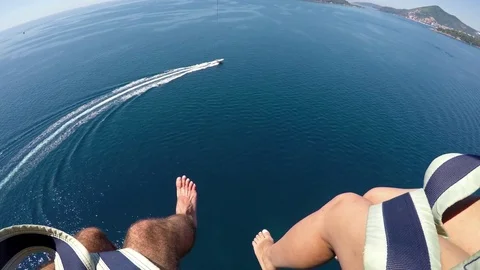 Couple enjoying parasailing Stock Footage 80234024