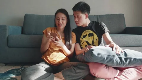 Couple Enjoying Time Together While Using a Smartphone Stock Footage 313830295