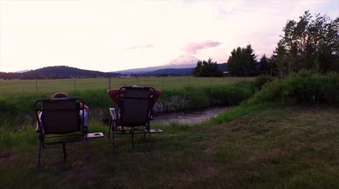 Couple enjoying the view of a Mountain. Stock Footage 68539922