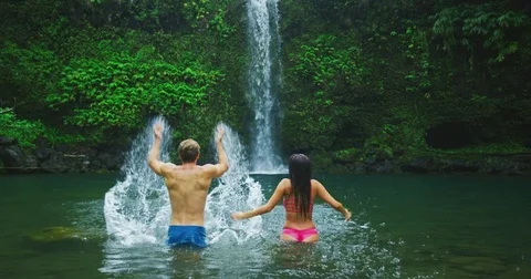 Couple Enjoying Waterfall Stock Footage 81257580