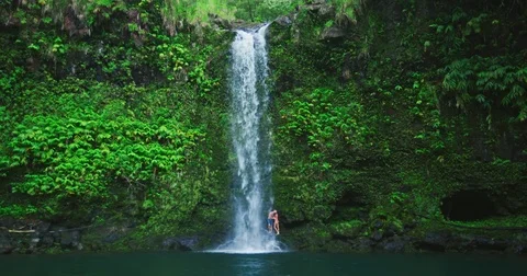 Couple Enjoying Waterfall Stock Footage 81257670