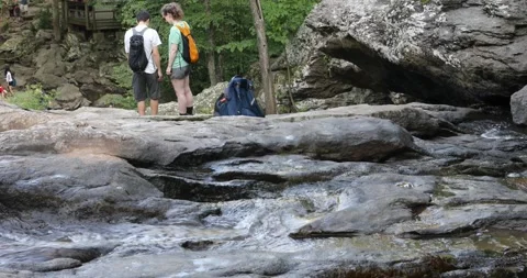A couple enjoys the view of Cunningham Falls in Thurmont, Maryland, USA Stock Footage 135950330