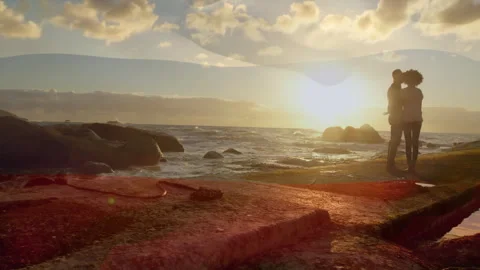 Couple entering jetty in third second, hugging, kissing beside black cable at 库存影片 312005235