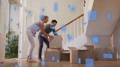Couple entering placing box onto staging stack while tech overlay animating over Stock Footage 333301283