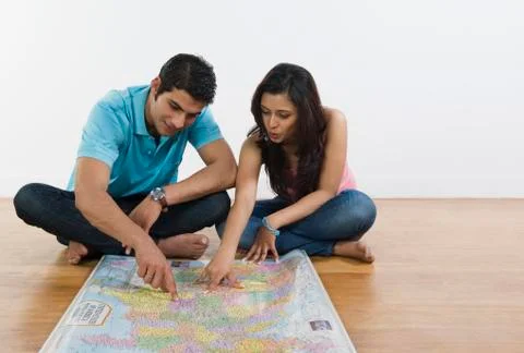 Couple examining a map Stock Photos