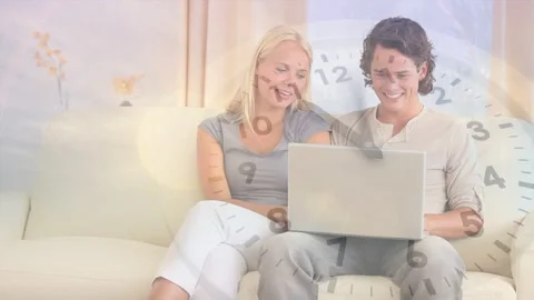 Couple exchanging smiles, man typing laptop, laughing as tech clock and moon Stock Footage 335739642