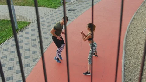 Couple exercising outdoors Stock Footage 100033851